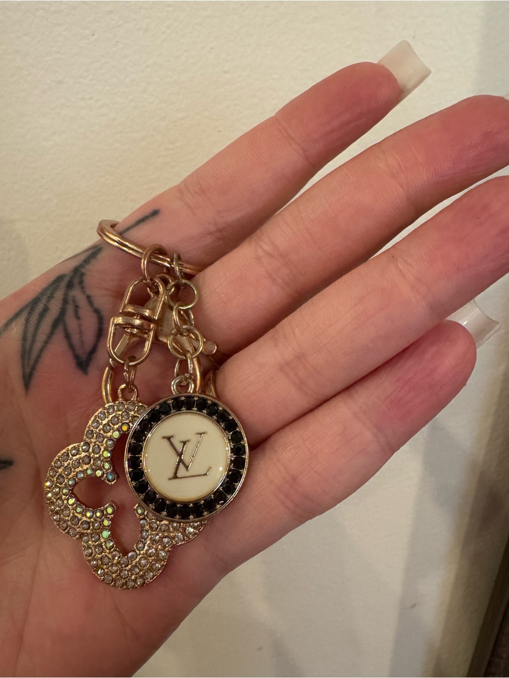 Louis Vuitton Gold-tone Crystal Logo Keychain with Black and Cream Accents
